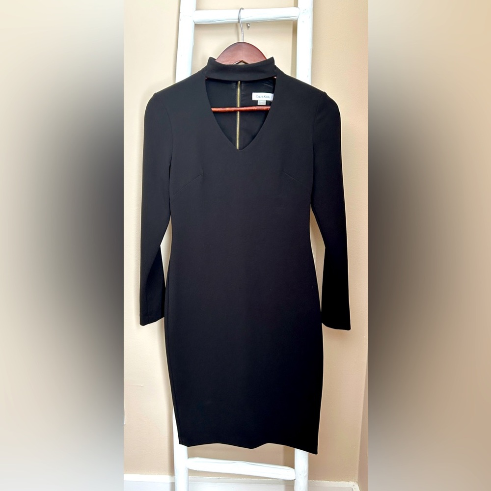Calvin Klein size 2 Black dress with gold zipper down the back. Worn once.